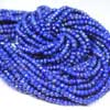 Natural Blue Lapis Lazuli Faceted Roundel Beads Strand Length 14 inches strand and Size 4mm approx.Royal Blue color beads. Lapis lazuli is a deep blue with a touch of purple and flecks of iron pyrite. Lapis consists of Lapis (blue, calcite (white streaks) and silver flakes of pyrite. Deep blue color gemstones are of best kind. 